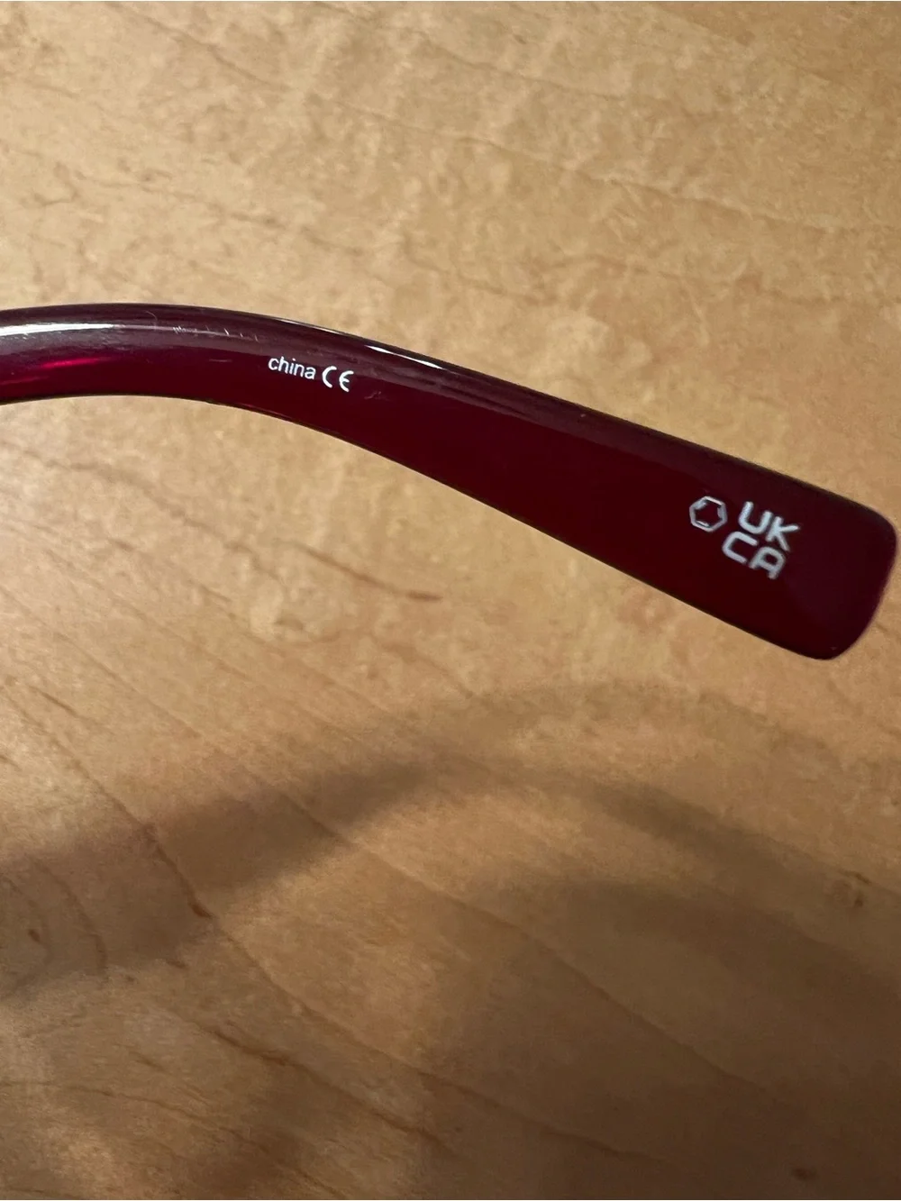 Le Specs Burgundy Oval Sunglasses with Dark Lenses